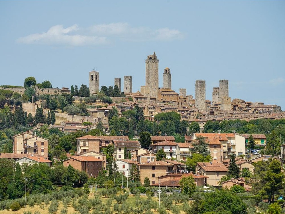 The medieval hill town of San Gimignano and its stone towers rising above the Tuscan countryside
